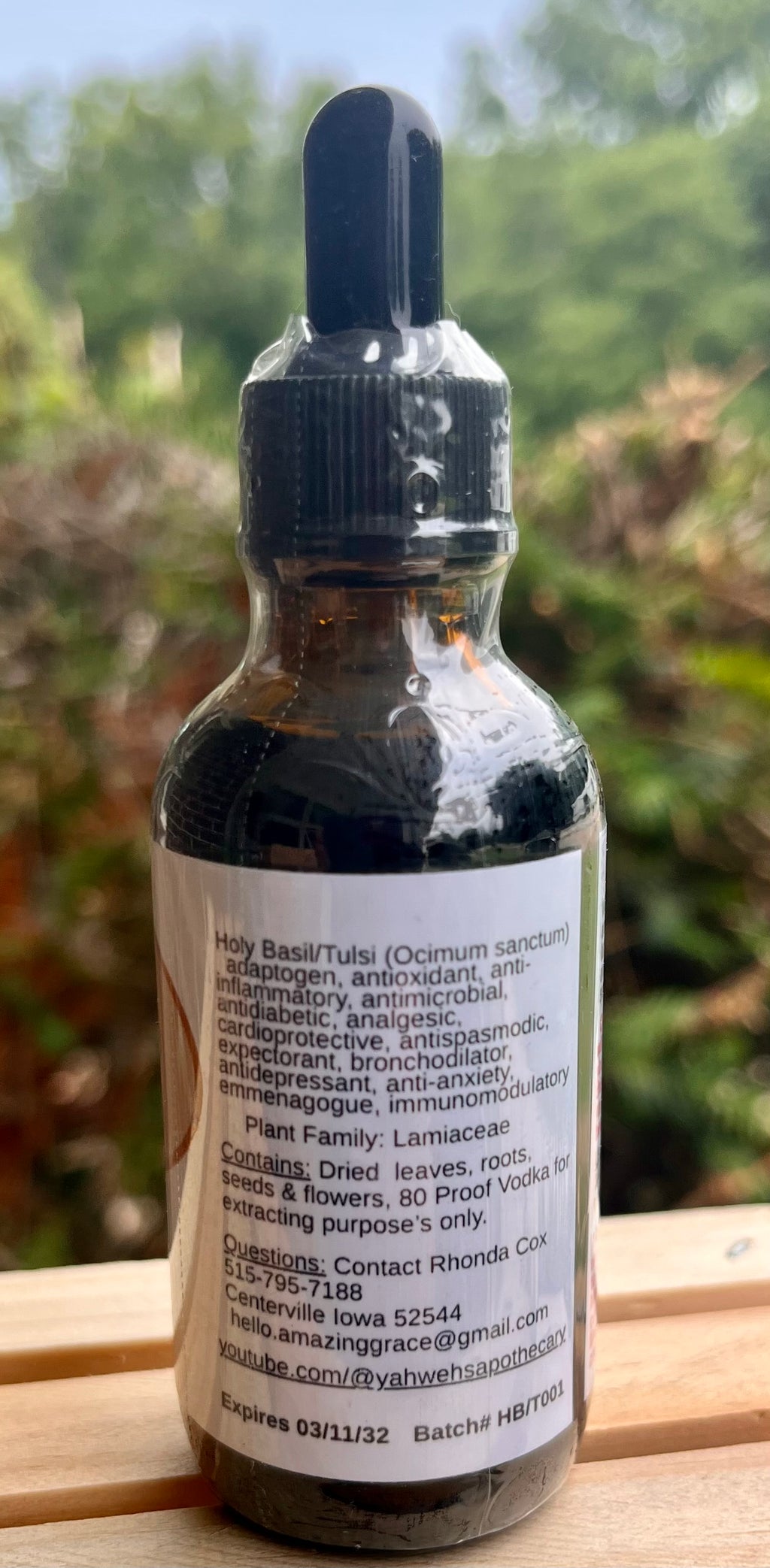 Side of Tulsi tincture bottle showing botanical details and ingredients