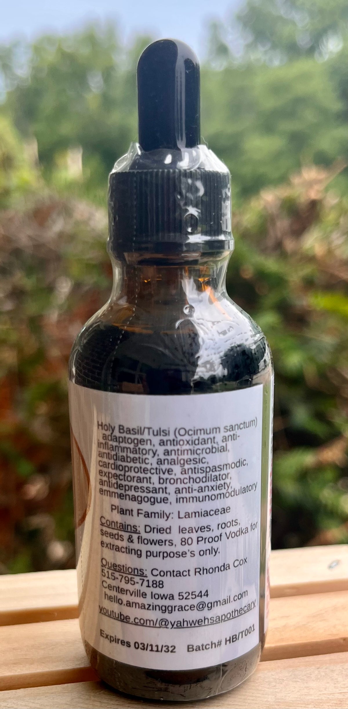 Side of Tulsi tincture bottle showing botanical details and ingredients