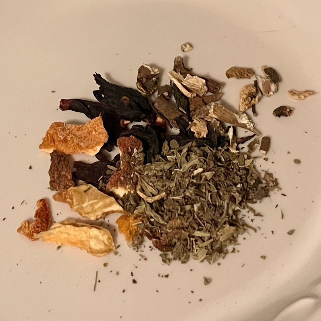 Assorted dried herbs and spices on a white surface